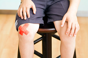 childhood knee pain - Copyright – Stock Photo / Register Mark