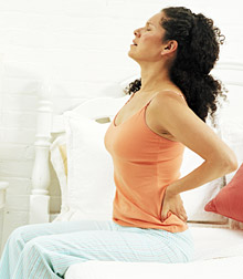 Lady having backpain - Copyright – Stock Photo / Register Mark