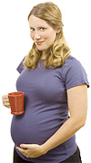 A pregnant woman holding a cup of coffee. - Copyright – Stock Photo / Register Mark