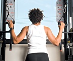 Chelsea Cooper demonstrates a kneeling cable pulldown. - Copyright – Stock Photo / Register Mark