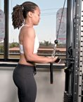 Chelsea Cooper demonstrates a tricep cable pulldown. - Copyright – Stock Photo / Register Mark