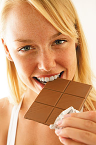 girl eating chocolate - Copyright – Stock Photo / Register Mark