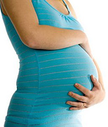 A pregnant woman's belly. - Copyright – Stock Photo / Register Mark