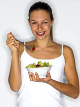 Lady eating salad - Copyright – Stock Photo / Register Mark