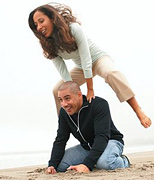 Woman leap-frogging over a kneeling man. - Copyright – Stock Photo / Register Mark