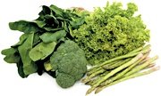 A pile of green vegetables including spinach, broccoli and asparagus. - Copyright – Stock Photo / Register Mark