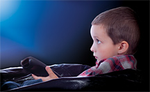 Kid watching TV - Copyright – Stock Photo / Register Mark