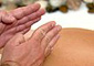 Woman receiving percussion massage. - Copyright – Stock Photo / Register Mark