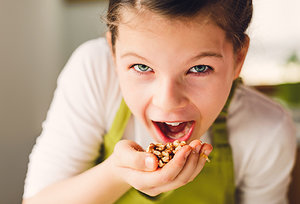 nuts in hand - Copyright – Stock Photo / Register Mark