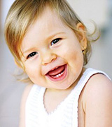 Baby girl laughing. - Copyright – Stock Photo / Register Mark
