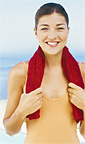 Woman standing in front of the ocean. - Copyright – Stock Photo / Register Mark