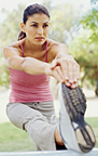 Woman stretching her legs before running. - Copyright – Stock Photo / Register Mark