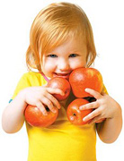 Little girl with an armfull of apples. - Copyright – Stock Photo / Register Mark