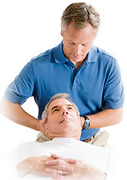 A chiropractor adjusts a middle aged man's neck. - Copyright – Stock Photo / Register Mark