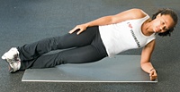 Chelsea Cooper demonstrating Side-Lying Iso Abs. - Copyright – Stock Photo / Register Mark