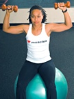 Chelsea Cooper demonstrates stability dumbbell shoulder press. - Copyright – Stock Photo / Register Mark