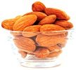 Small glass bowl of Almonds. - Copyright – Stock Photo / Register Mark