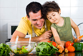 father and son eating salad - Copyright – Stock Photo / Register Mark