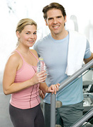 A middle aged couple at the gym. - Copyright – Stock Photo / Register Mark