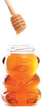 A bottle of honey. - Copyright – Stock Photo / Register Mark