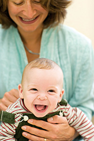 woman holding baby - Copyright â€“ Stock Photo / Register Mark