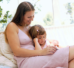 woman with child - Copyright – Stock Photo / Register Mark