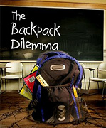 Backpack stuffed full of school supplies in classroom. - Copyright – Stock Photo / Register Mark