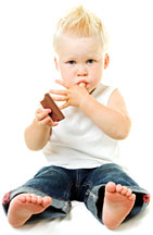 Boy with chocolate - Copyright – Stock Photo / Register Mark