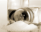 A spilled shaker of salt. - Copyright – Stock Photo / Register Mark