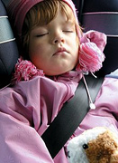 Child sitting in a car seat. - Copyright – Stock Photo / Register Mark