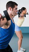 Man and woman exercising with barbells. - Copyright – Stock Photo / Register Mark