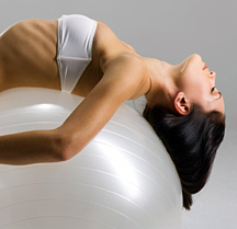 Lady stretching on exercise ball - Copyright – Stock Photo / Register Mark