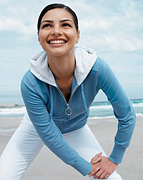 Woman stretching her legs. - Copyright – Stock Photo / Register Mark