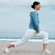 Woman stretching her legs. - Copyright – Stock Photo / Register Mark