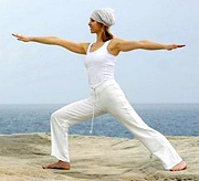Woman performing Tai Chi at the beach. - Copyright – Stock Photo / Register Mark