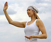 Woman performing Tai Chi. - Copyright – Stock Photo / Register Mark