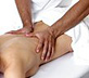 Woman receiving lower back massage. - Copyright – Stock Photo / Register Mark